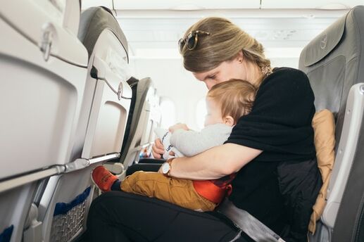 baby with mom on plane