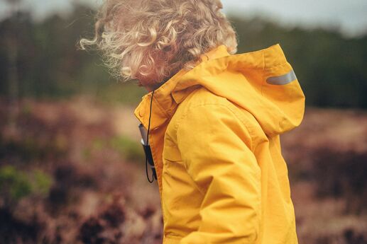 toddler in raincoat
